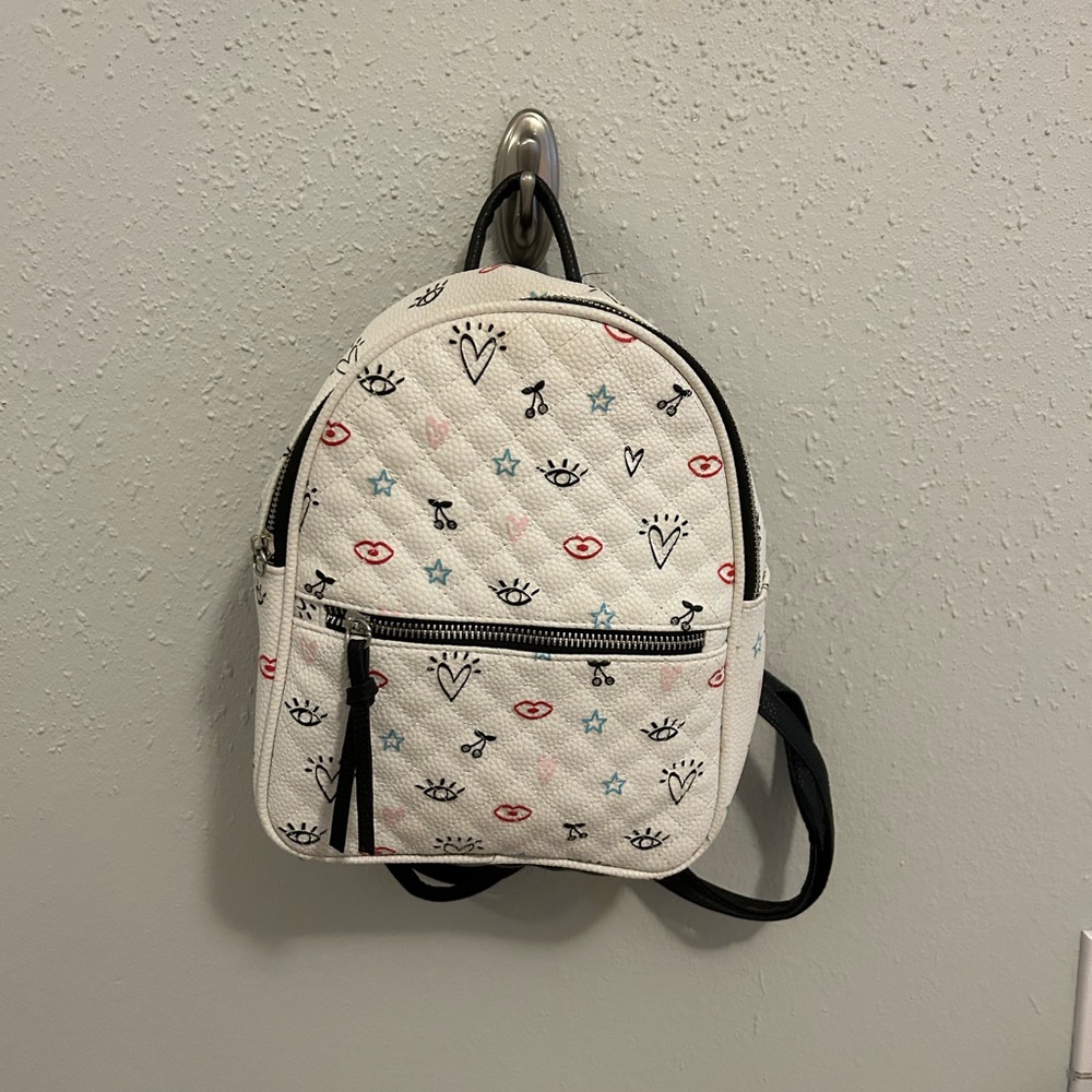 Claire’s patterned mini backpack